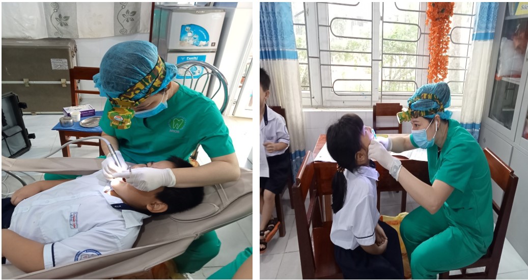 Bác sĩ khám và điều trị răng sâu cho các em học sinh